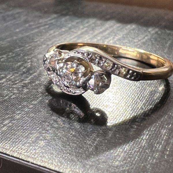 Antique 3 stone diamond twist ring with ros3 diamonds. Platinum on top and gold band