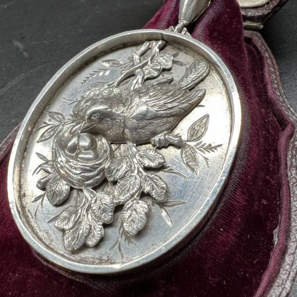 Rare Antique silver locket with bird and nest in relief